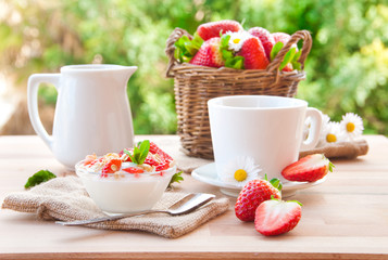 Healthy breakfast with yoghurt, fruit and coffee