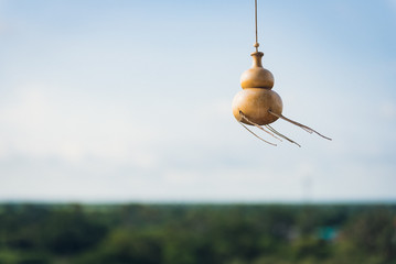 amulet calabash hang from ceiling with blue sky background