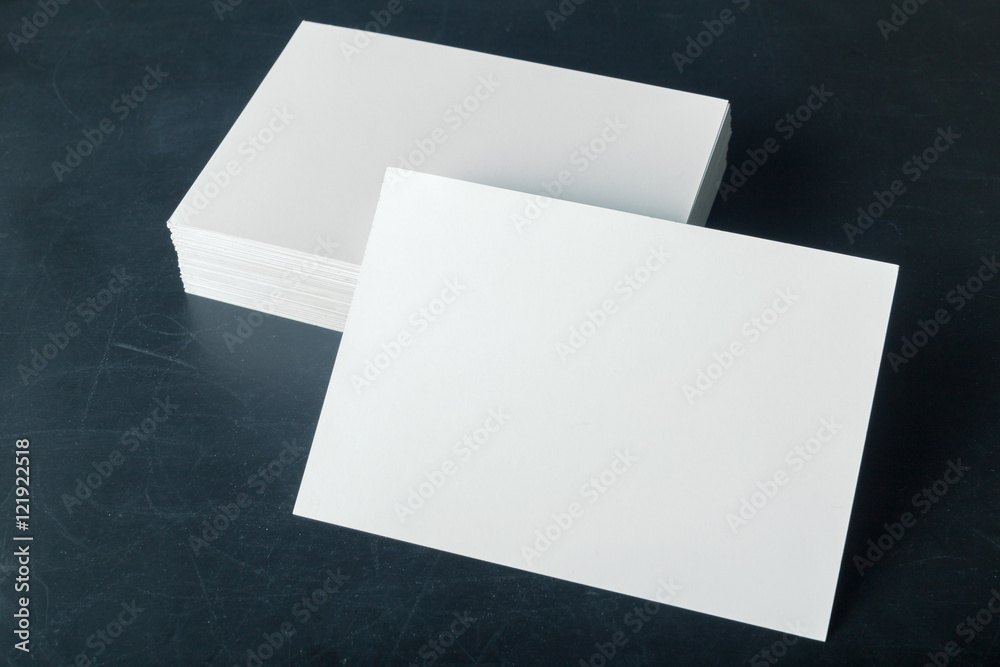 Wall mural backed paper blank business cards on the stack