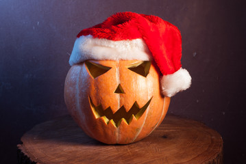 Jack-o ' - lantern in a red Santa hat,