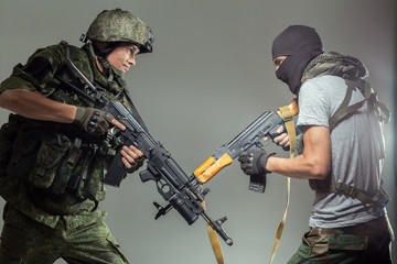 Russian soldier fighting against a terrorist - obrazy, fototapety, plakaty