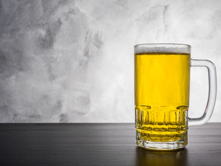 Glass of beer on a grunge background.