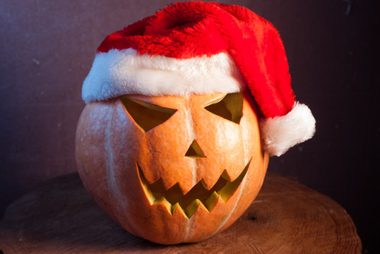 Jack-o ' - lantern in a red Santa hat,