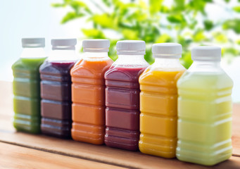 bottles with different fruit or vegetable juices