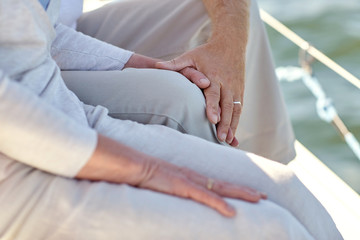 close up of senior couple on sail boat or yacht