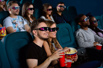 Lovely young couple on a date at the cinema