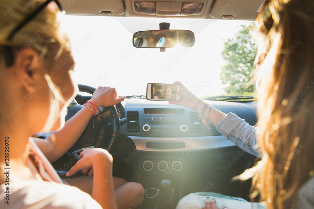 Sticker teenage girls or women with smartphone in car