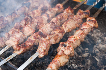 Meat skewers on a charcoal grill