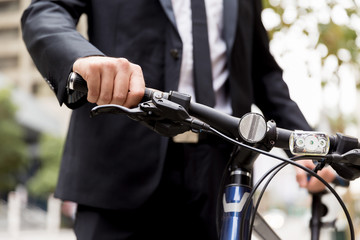 Young businessmen with a bike