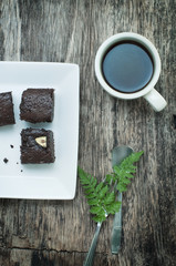 coffee and brownie on a wooden table