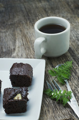 coffee and brownie on a wooden table
