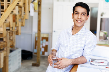 Young man architect in office