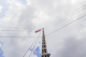 Horn speakers on tower against twilight sky and cloudy day