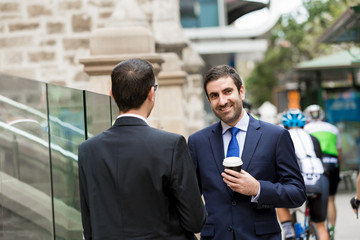 Two businessmen talking outdoors