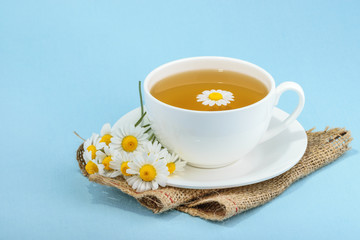 Cup of tea and chamomiles