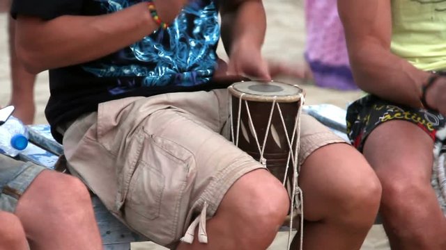 man playing on drum 