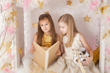 Two girls with a book