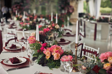 Wedding table for guests decorated with flowers