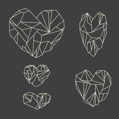 Set of mineral heart-shaped crystals on grey background