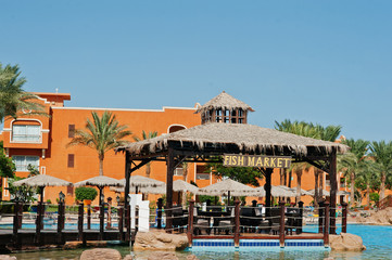 Fish market on pool at resort on sunny day