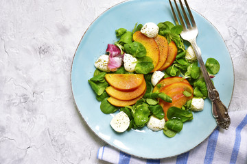 Fresh peach salad with corn and mozzarella.Top view.
