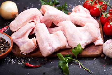 fresh raw chicken wings with vegetables