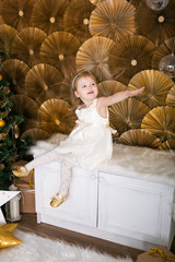 Little girl near a Christmas tree