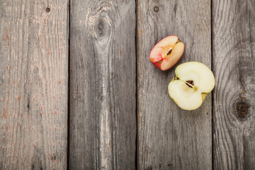 Apples on gray old planks wood table