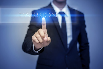 Businessman hand touching PASSION button on virtual screen
