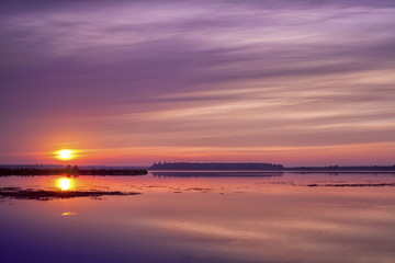 Fototapeta na wymiar pink sunrise over the lake