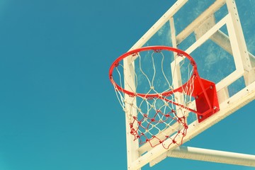 Basketball hoop on a blue sky,color filter