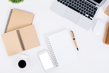 Notepads, smartphone and coffee