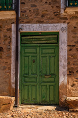 Fototapeta premium Antique wooden door in a stone house
