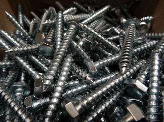 Round shank hex head screw bolts at the shelf at hardware shop
