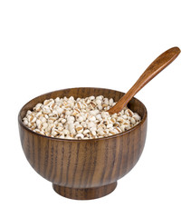 Job s Tears. Heap of organic brown rice in wooden bowl