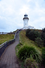 Fototapeta na wymiar Scenic Hill Approaching White Byron Bay Lighthouse