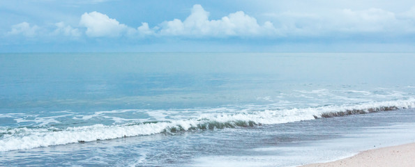 Pale blue calm sea and beach