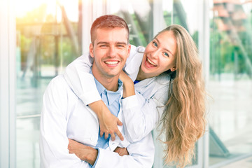 Cheerful couple of medical students smiling at camera - Concept of positivity  success and achievements in the study and in the working world 