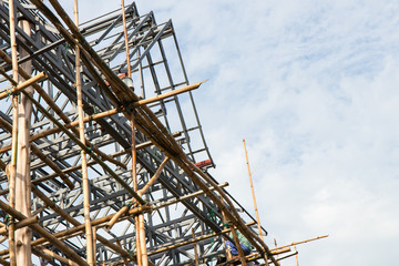 Steel roof truss workers.
