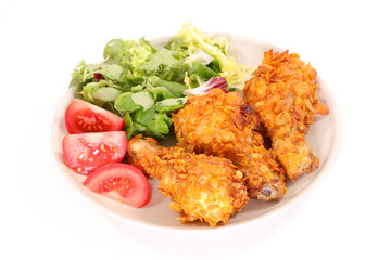fried chicken with salad and tomato