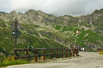 barrier meandering mountain road