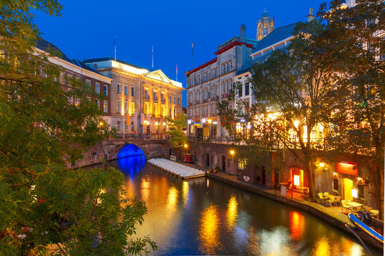 Canal Oudegracht and bridge in the colorful illuminations at night, Utrecht, Netherlands