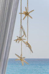 Beautiful beach and sea view with sea stars decoration © Ivan Stanic