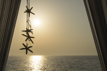 Sea stars decoration hanging from the white baldachin with beaut © Ivan Stanic