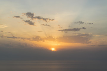 Orange sunset over the cloudy sky over calm sea 2