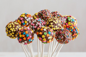 Delicious holiday colored cake pops in a glass