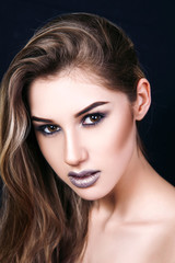 Fototapeta premium The girl, a woman, a beautiful young girl with professional make