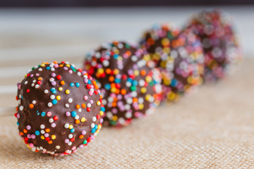 Delicious holiday colored cake pops in a glass