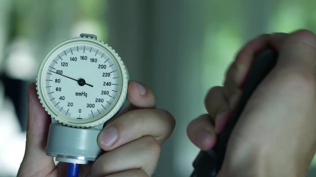 Doctor Measures The Blood Pressure