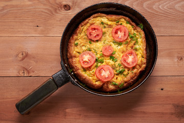 scrambled eggs on a wooden table
